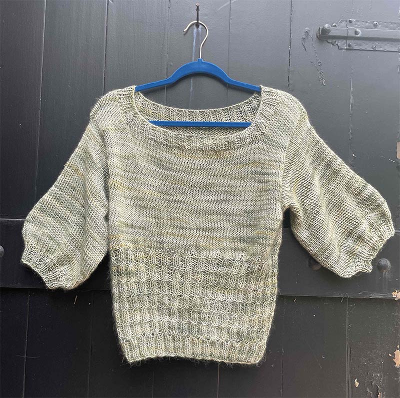Sage sweater, cabling in the bottom, 3/4 blouse sleeve.