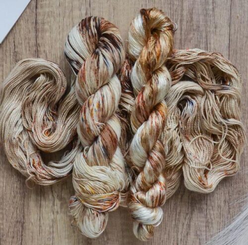 Picture of yarn dyed in a variety of cinnamon and cream shades.