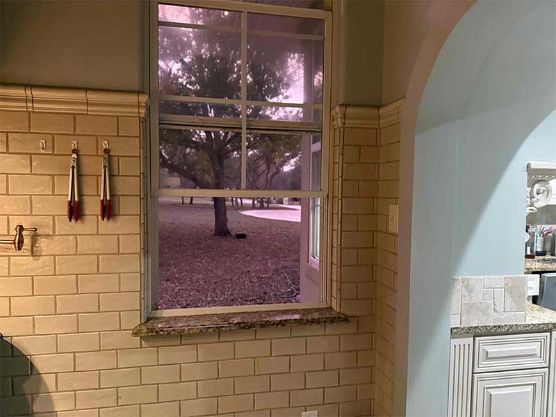 View of the kitchen window, showing the full purpleness. 