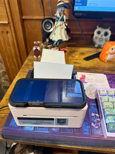 Very small pink printer. 